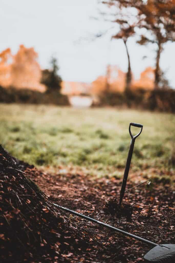 A home compost pile with tools to turn it.  Photo by Annie Spratt